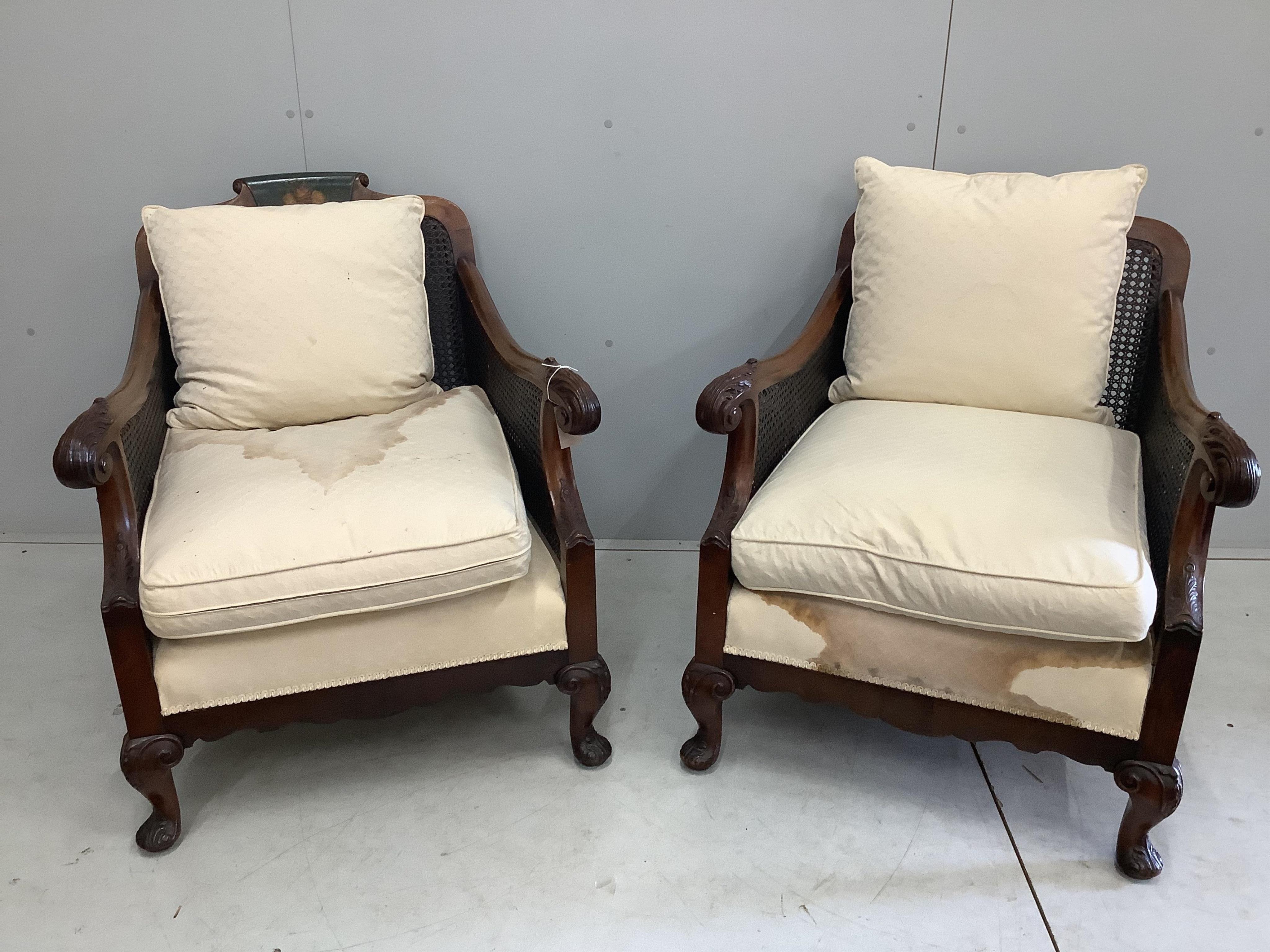 An early 20th century part painted walnut three piece bergere suite, settee width 186cm, depth 78cm, height 80cm